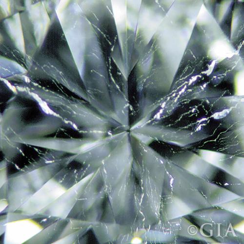 A close up of a diamond with a twinning wisp.