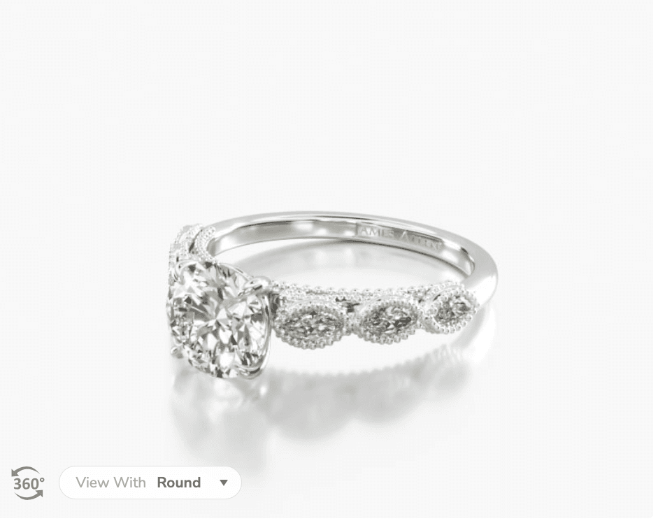 Platinum cathedral milgrain marquise diamond engagement ring.