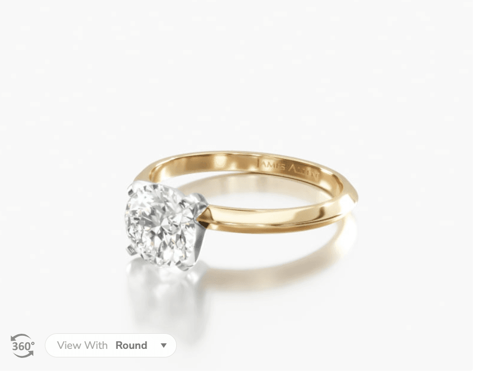 14K yellow gold knife edge solitaire engagement ring.