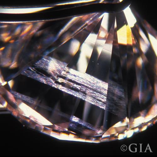 A close up of a diamond with internal grading.