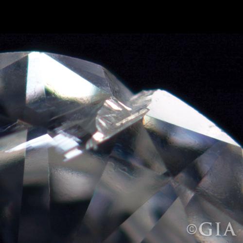 A close up of a diamond with a cavity in it.