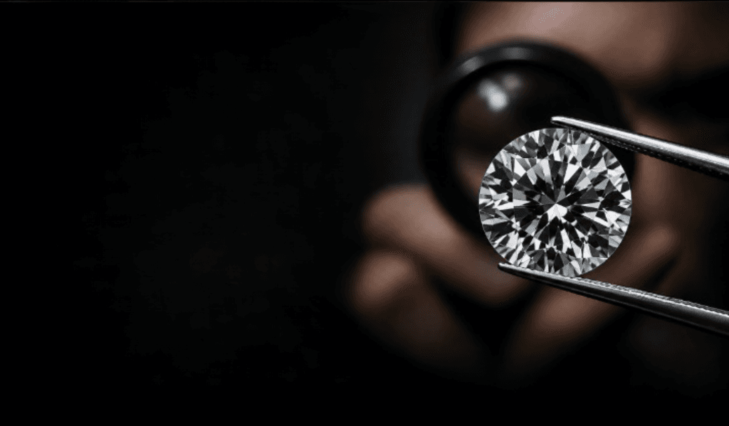 Jeweler inspecting round brilliant diamond with tweezers