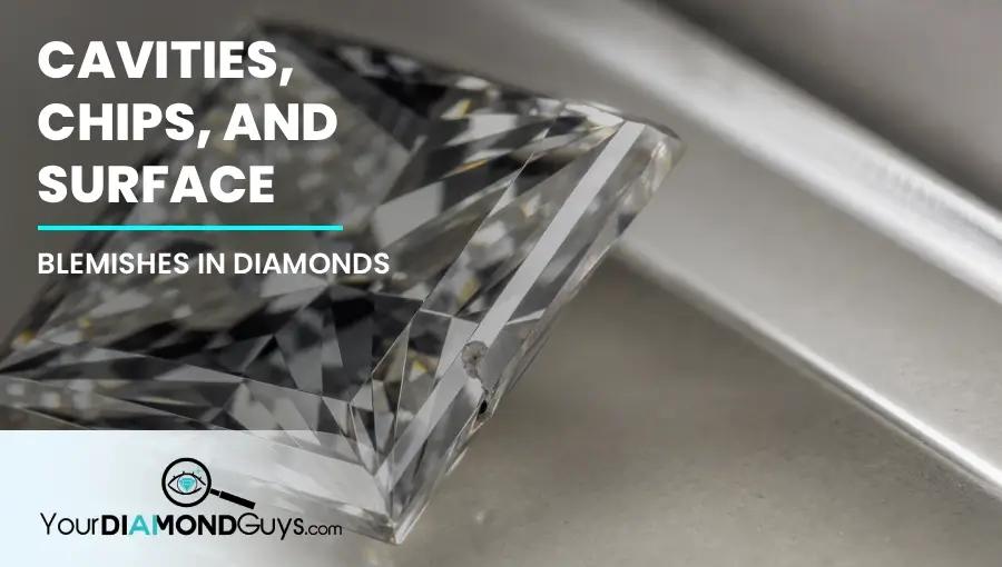 Loose princess cut diamond under raking light showing a chipped corner, open cavity, and surface blemish risk