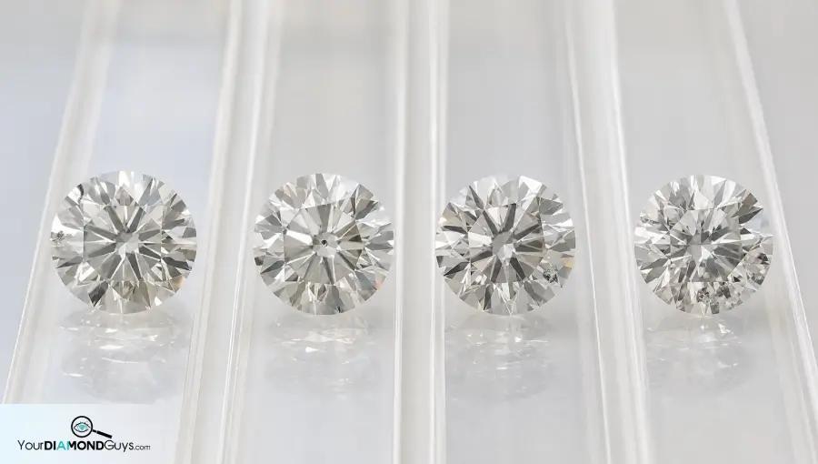 Four round diamonds showing edge table girdle and multiple knot inclusion checks