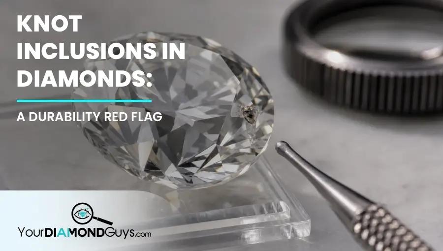 Tilted round diamond showing a surface reaching knot inclusion at the girdle with a jeweler probe nearby