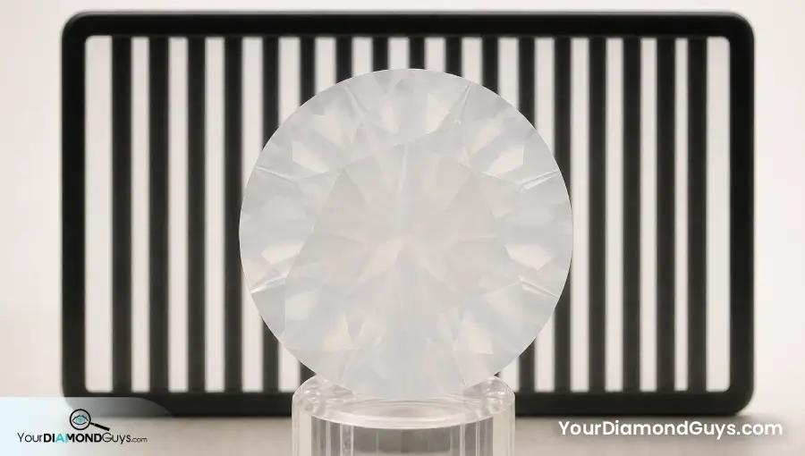 Milky round diamond broadly obscuring a black and white transmission target