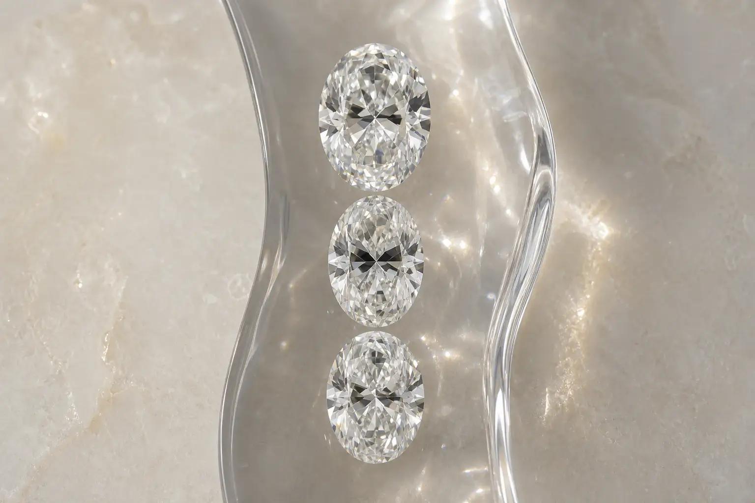 Three comparable oval diamonds showing mild and strong bow tie contrast in a peer group