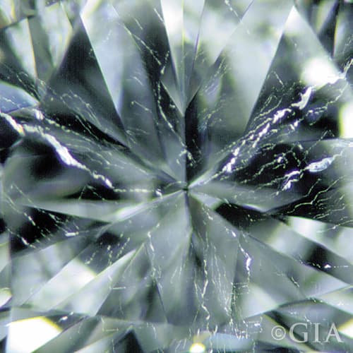 A close up of a diamond with a twinning wisp.