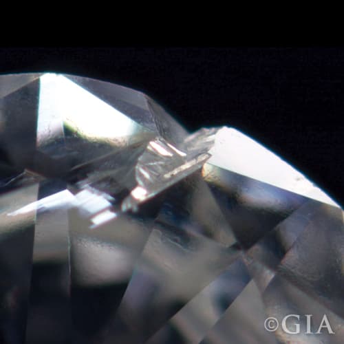 A close up of a diamond with a cavity in it.