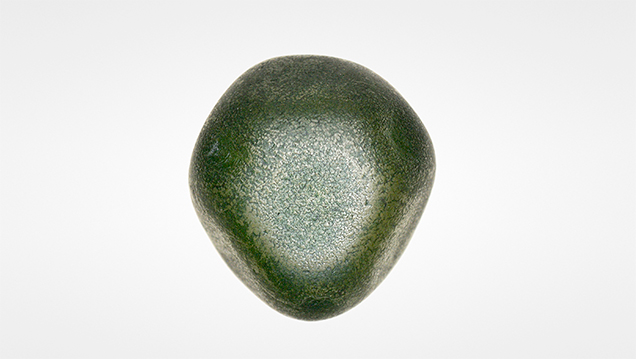 The 6.49 carat rough diamond with uneven green chromium oxide coating